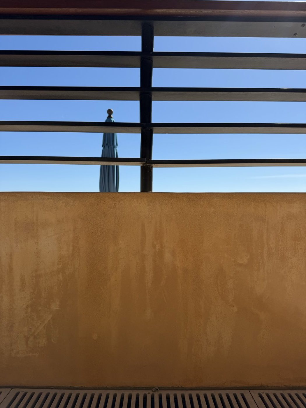 Stucco wall back to an even, film free finish after a post construction wash