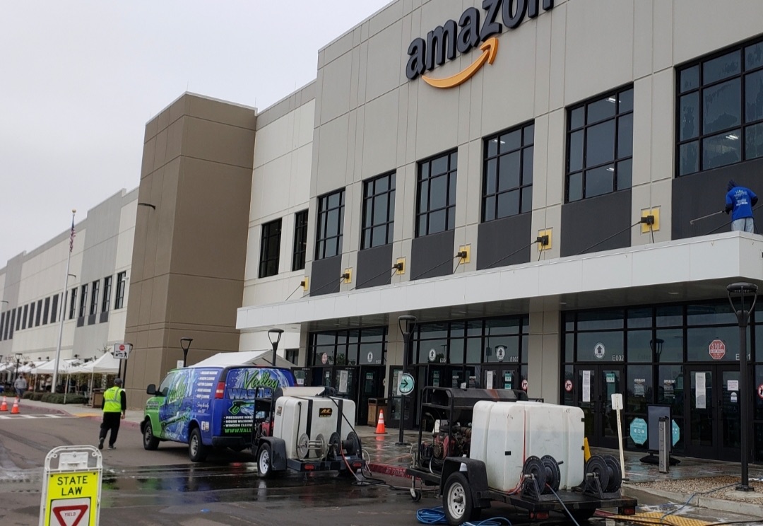 Valley Wash Pros crew servicing a commercial building exterior in the Central Valley