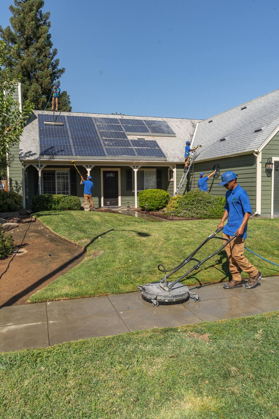 Valley Wash Pros crew soft washing a Central Valley home exterior at low pressure