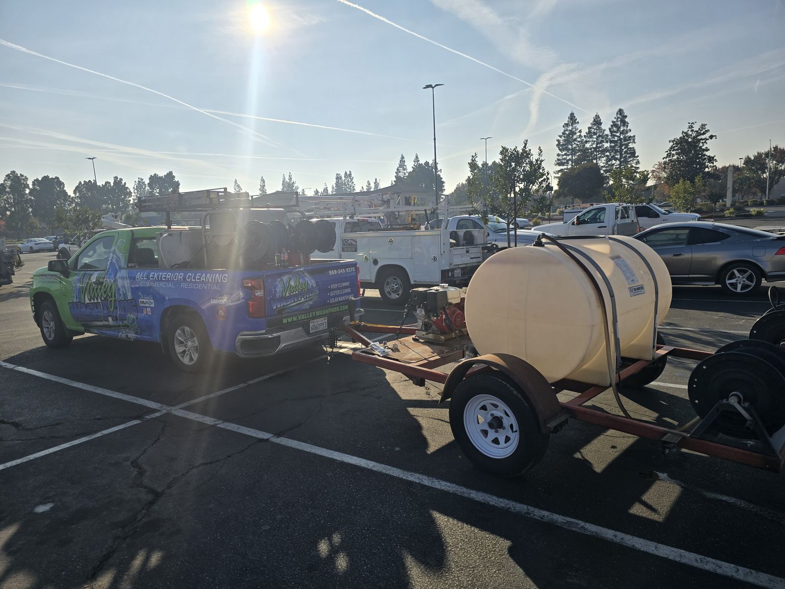 Valley Wash Pros truck hitched to the water tank trailer used to wash fleets on site at Central Valley yards