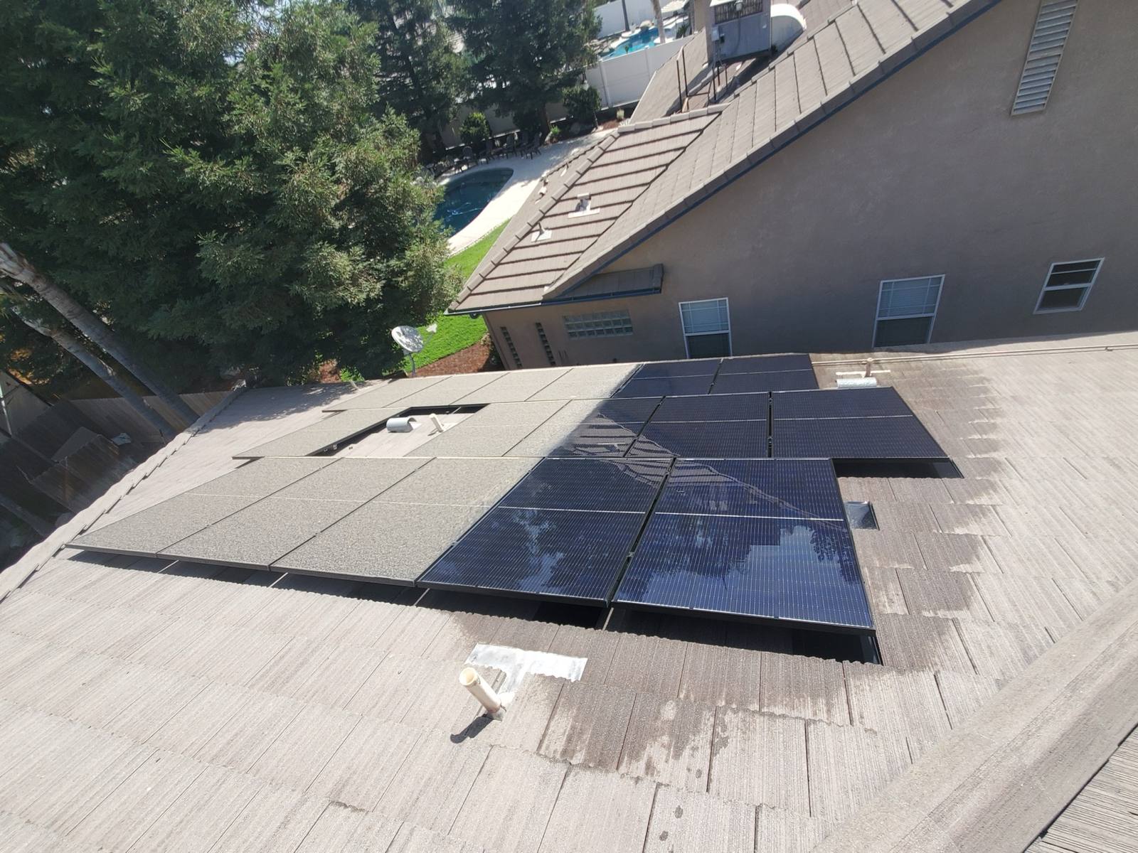 Freshly cleaned rooftop solar array on a Fresno home, output restored