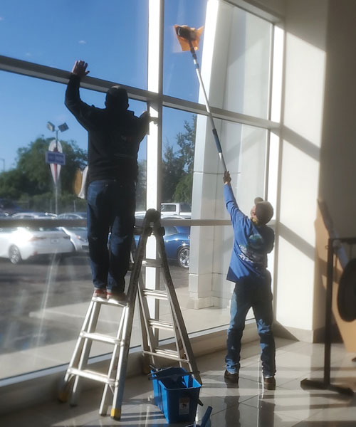 window cleaning professionals cleaning commercial property windows inside